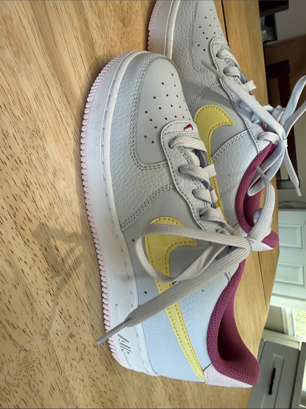Nike Kids Low-Top Sneakers in White with Yellow Swoosh and Pink Accents